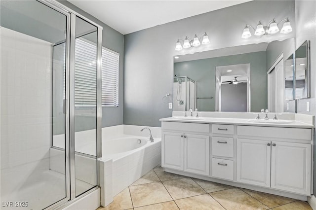 bathroom featuring tile patterned flooring, ceiling fan, separate shower and tub, and vanity