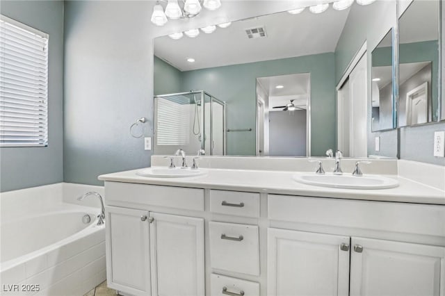 bathroom featuring vanity, ceiling fan, and shower with separate bathtub