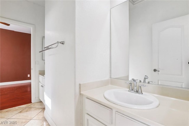 bathroom featuring tile patterned flooring and vanity