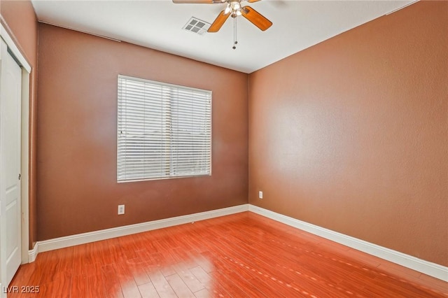 unfurnished room featuring ceiling fan and wood-type flooring