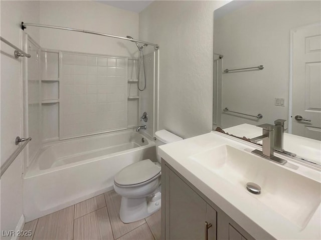 full bathroom featuring toilet, vanity, and tub / shower combination