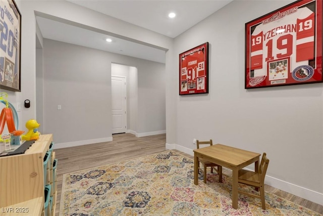 living area with wood-type flooring