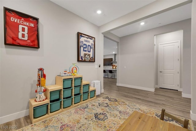 game room with hardwood / wood-style flooring