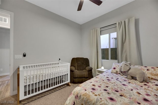 bedroom with ceiling fan and carpet