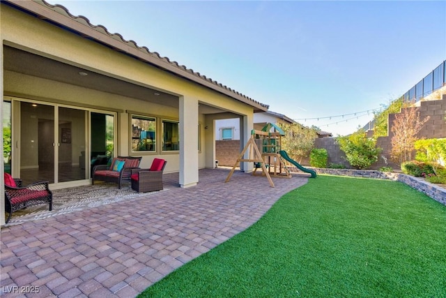 view of yard with a playground and a patio