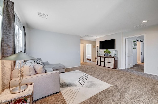 living area with recessed lighting, carpet flooring, visible vents, and baseboards