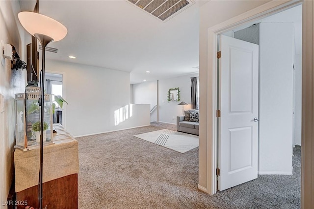 interior space featuring recessed lighting, visible vents, and baseboards