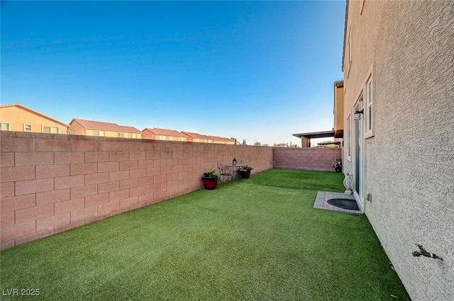 view of yard featuring a fenced backyard