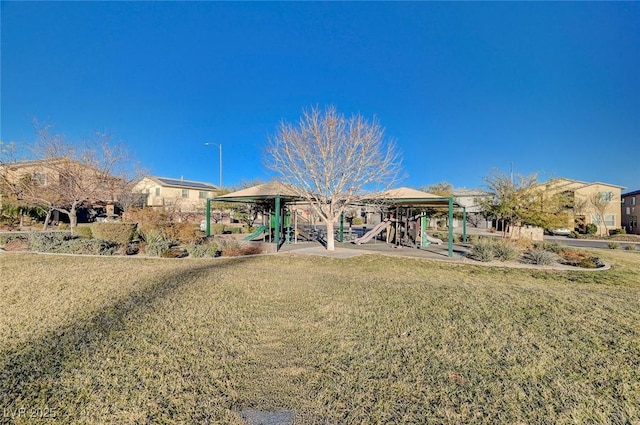 exterior space featuring playground community and a front lawn