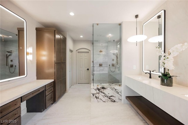 bathroom with vanity and an enclosed shower