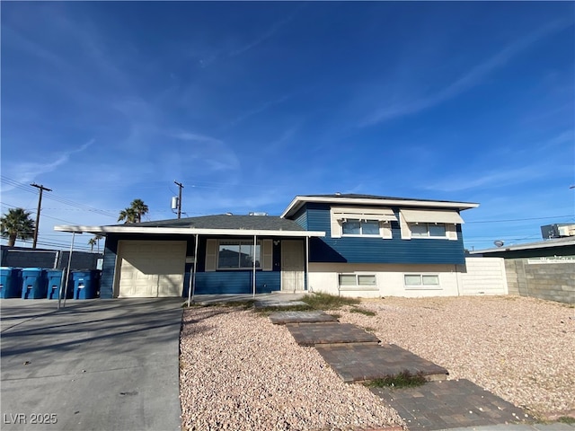 tri-level home with cooling unit and a garage