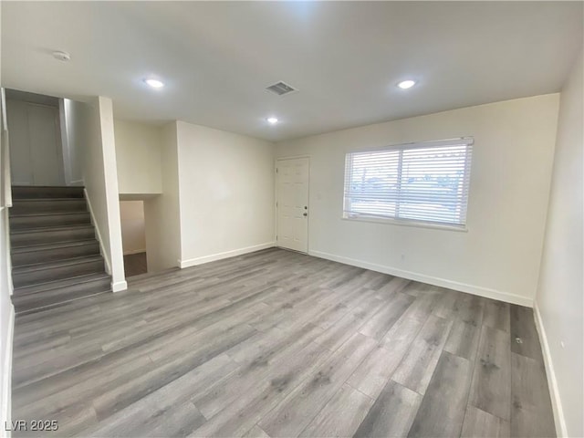 unfurnished room with light hardwood / wood-style flooring