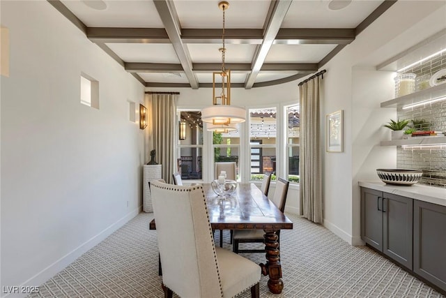 dining area featuring beam ceiling, light colored carpet, and coffered ceiling