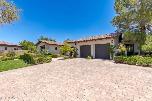 mediterranean / spanish house featuring a garage