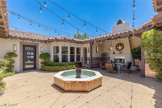 exterior space with an outdoor living space with a fireplace