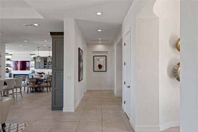 hall with light tile patterned flooring