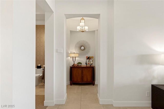 corridor with light tile patterned flooring