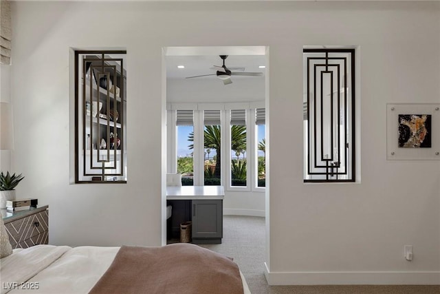 carpeted bedroom with ceiling fan