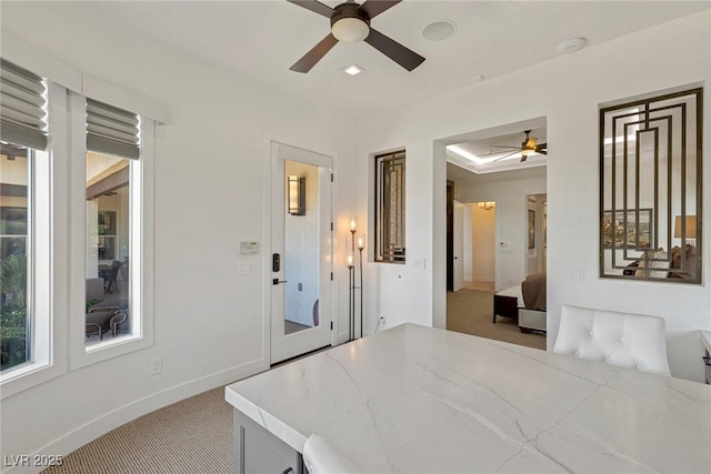 bedroom featuring ceiling fan and light carpet