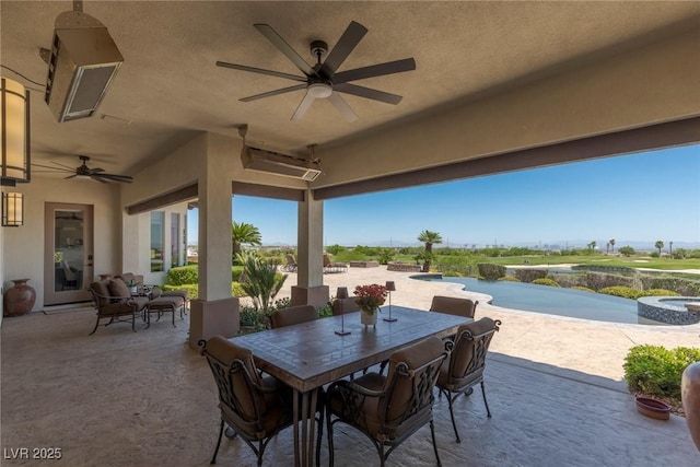 view of patio / terrace featuring a swimming pool with hot tub and ceiling fan