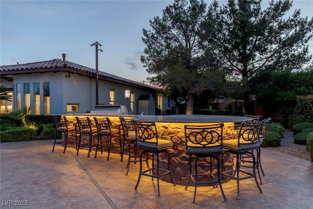 view of patio with an outdoor bar