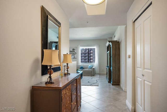 hallway featuring light tile patterned floors