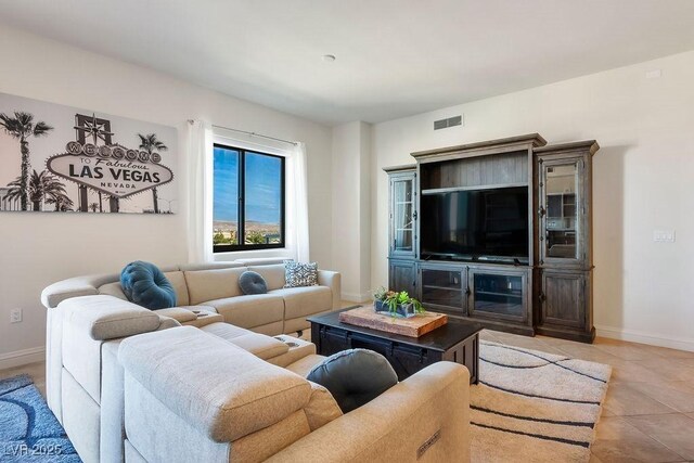 living room with light tile patterned flooring