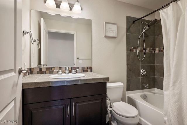 full bathroom featuring vanity, shower / tub combo, and toilet