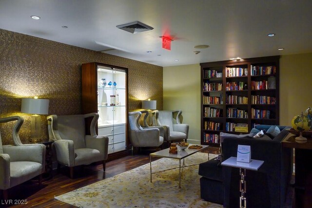 sitting room featuring dark wood-type flooring