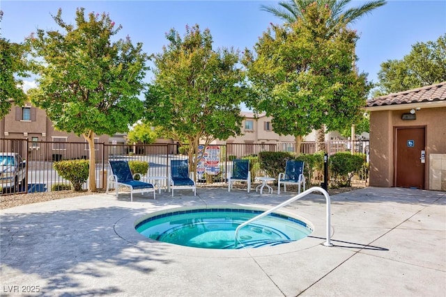 view of pool with a patio area and a community hot tub