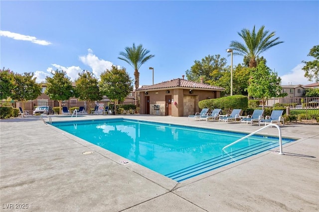 view of swimming pool with a patio area