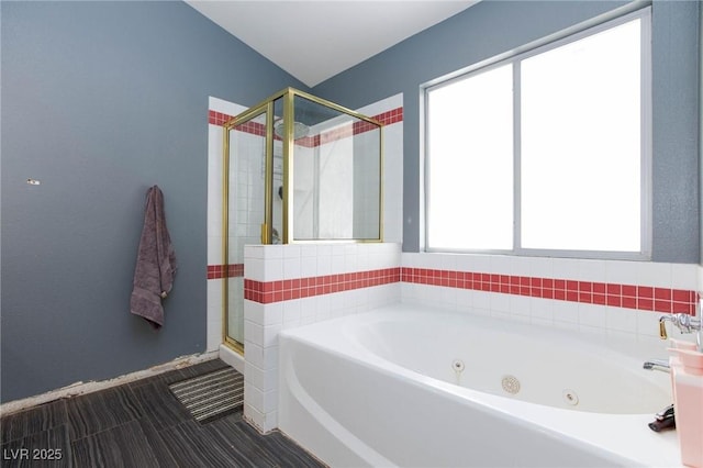 bathroom featuring separate shower and tub and a wealth of natural light