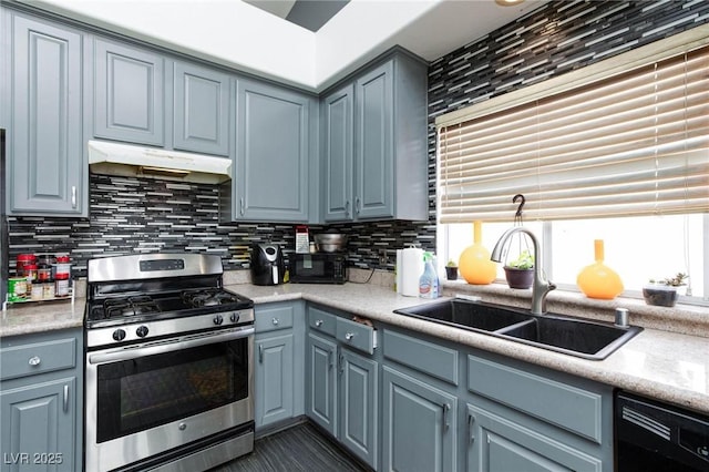 kitchen featuring sink, dishwasher, gas stove, and backsplash