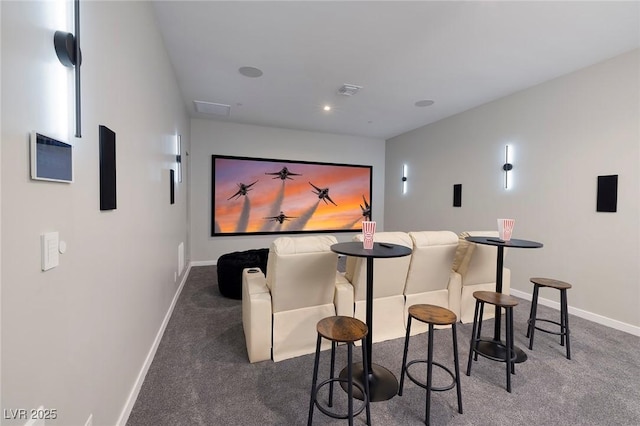 carpeted home theater room featuring baseboards, visible vents, and recessed lighting