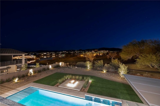 pool at twilight with a yard