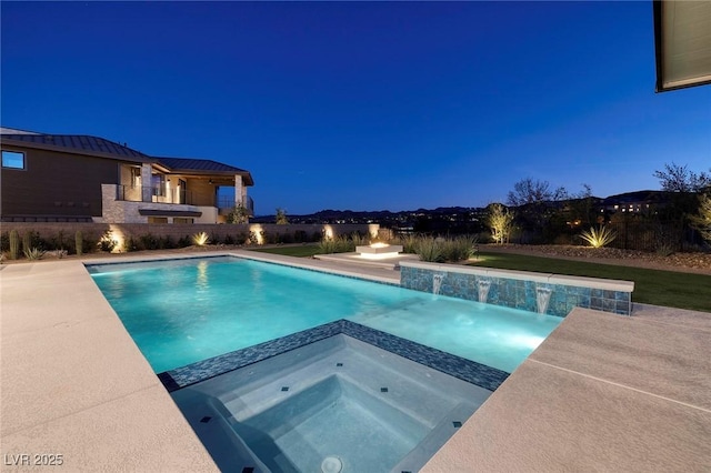 view of swimming pool with an in ground hot tub