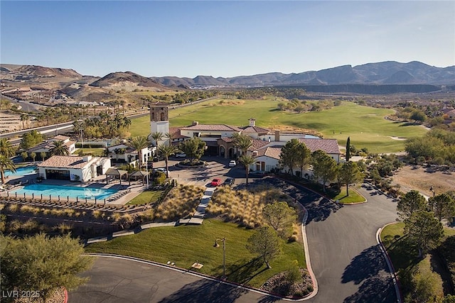 birds eye view of property with a mountain view