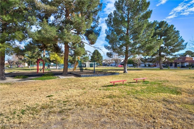 exterior space featuring a playground and a lawn