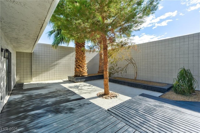 wooden terrace with a patio