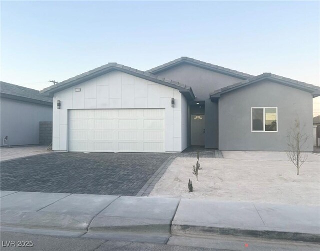 ranch-style home featuring a garage