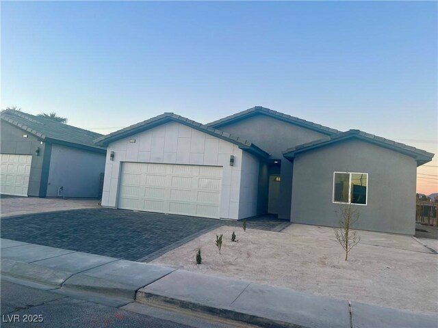 ranch-style home featuring a garage