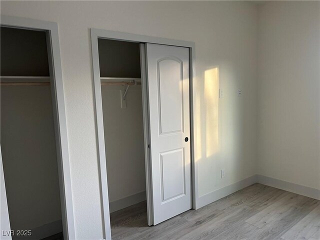 unfurnished bedroom featuring light hardwood / wood-style flooring