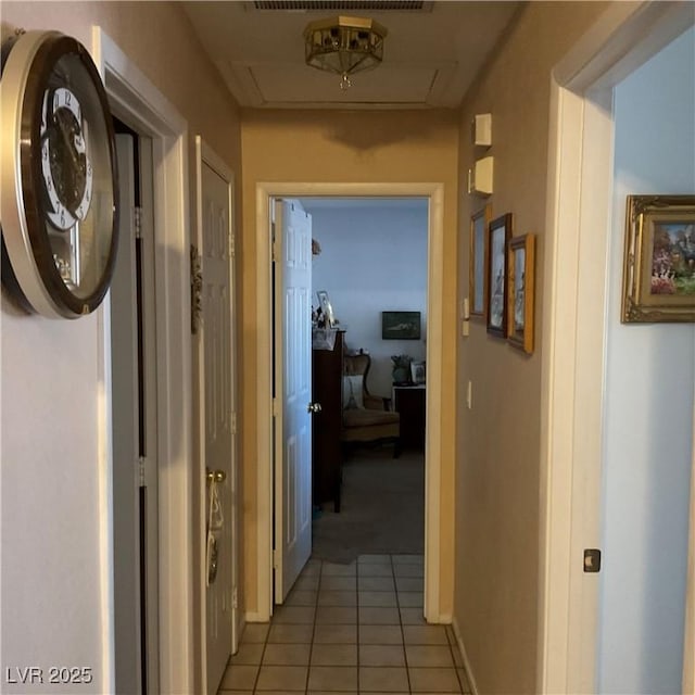 corridor featuring light tile patterned flooring