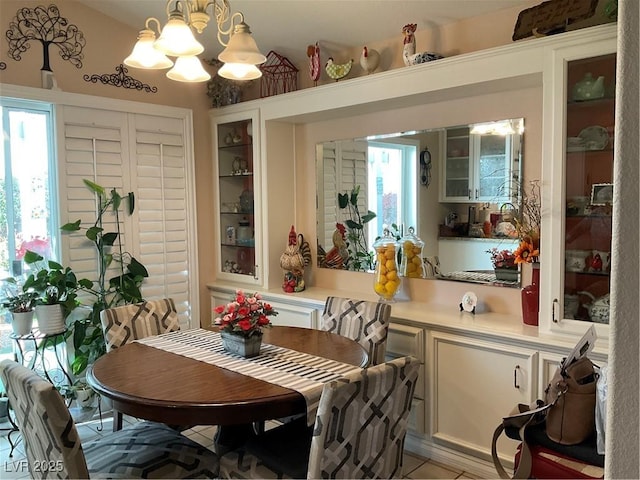 dining room with a chandelier and a healthy amount of sunlight