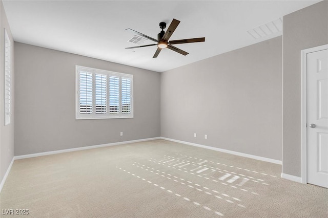 unfurnished room with visible vents, ceiling fan, light carpet, and baseboards