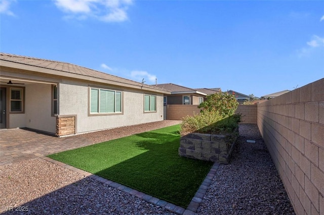 view of yard featuring a fenced backyard and a patio