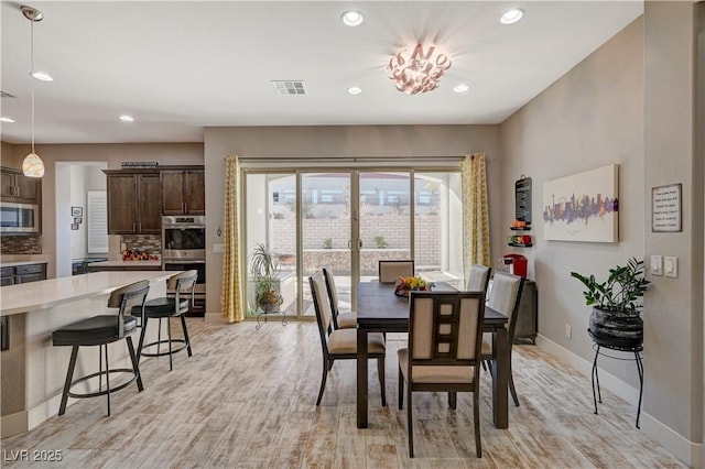 dining room with light hardwood / wood-style floors