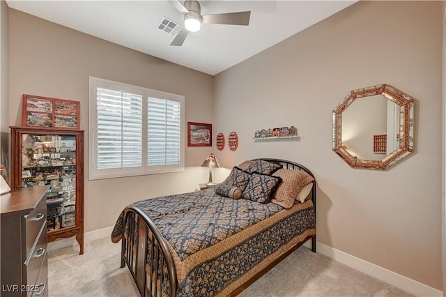 bedroom with ceiling fan and light colored carpet