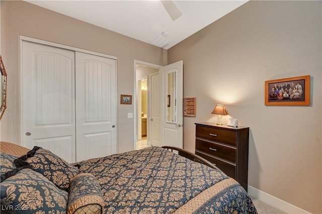 carpeted bedroom with ceiling fan and a closet