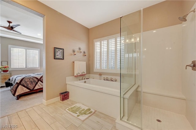 bathroom featuring ceiling fan and shower with separate bathtub